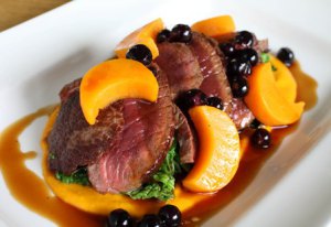 SEARED VENISON WITH BUTTERNUT SQUASH PUREE, SAVOY CABBAGE AND BLACKCURRANT