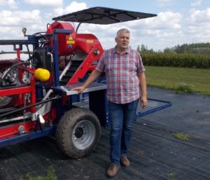 Andris Krogzems with one of his machines