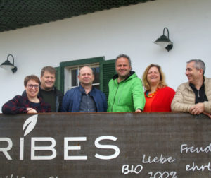 IBA Executive and Franz and Gudrun Schriebl, blackcurrant growers in Austria, standing in front of the Ribes farm