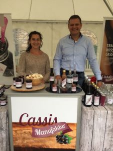 Sales stall of Cassismanufaktur with owner Heiko Danner standing behind his products